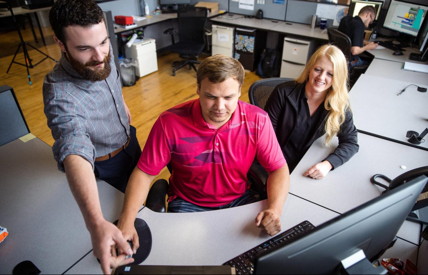 Engineers Looking at a Computer