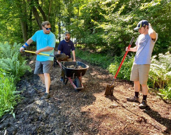 Volunteers spreading mulch at Harbor Humane