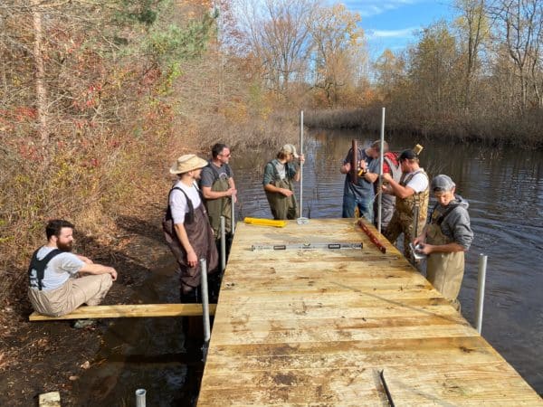Volunteers putting in a doc at ODc