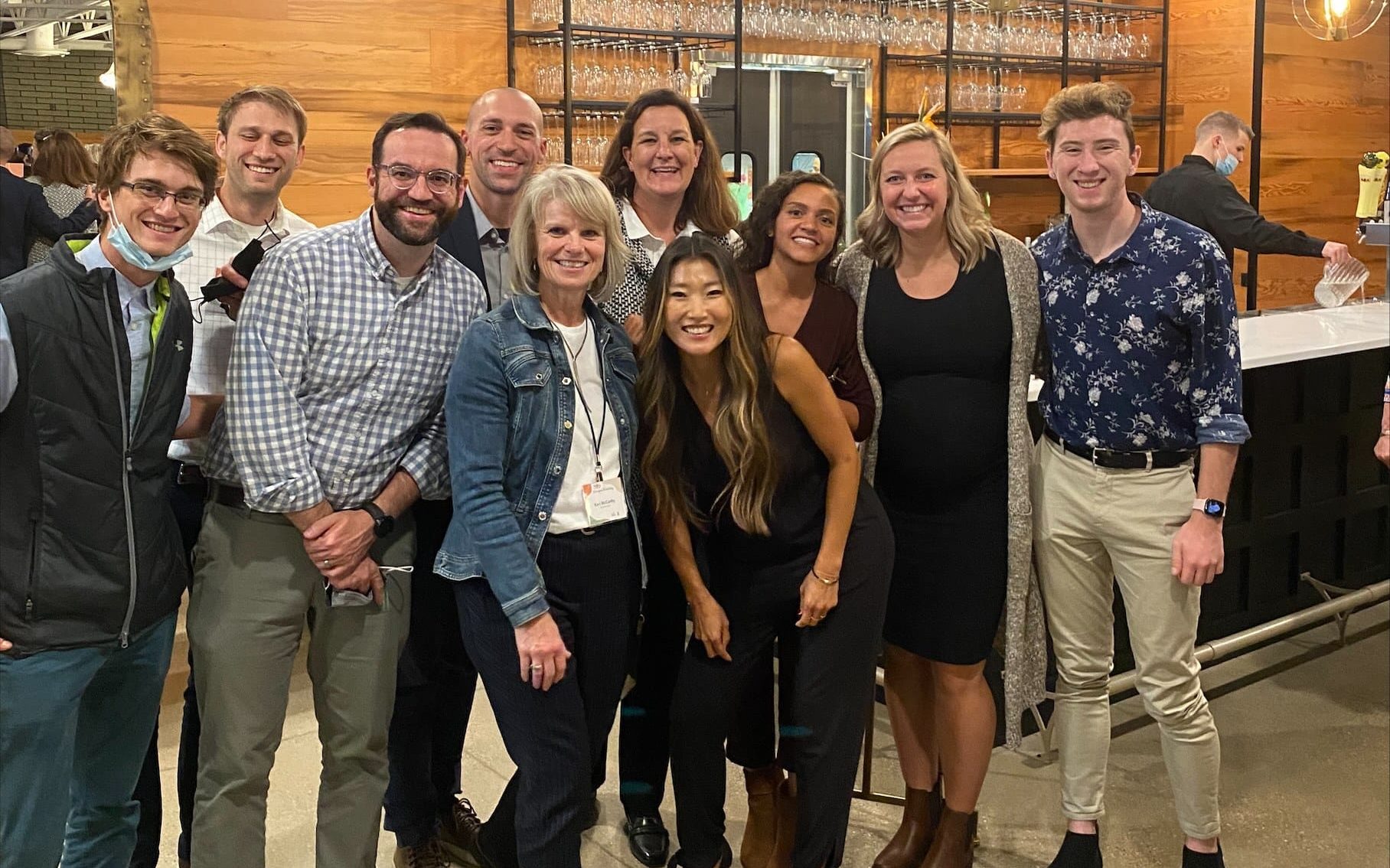 A group of DISHER employees at an event